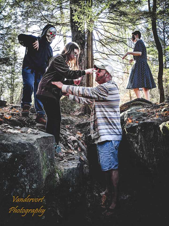 Daughter zombie putting zombie makeup on the daddy zombie, Bilger's Rocks - photo by Vandervort Photography